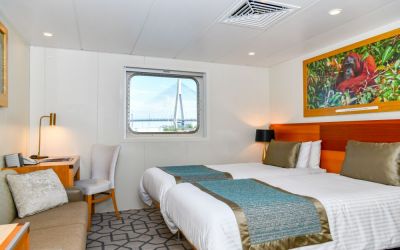 coral-discoverer-promenade-deck-stateroom-twin-bedding-10009BEA9232-C903-D8D4-EA77-5CC83978BB84.jpg